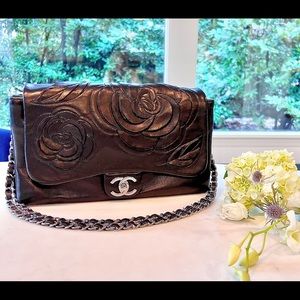 SOLD. Chanel black lambskin leather camellia bag with red tweed petal underlay.